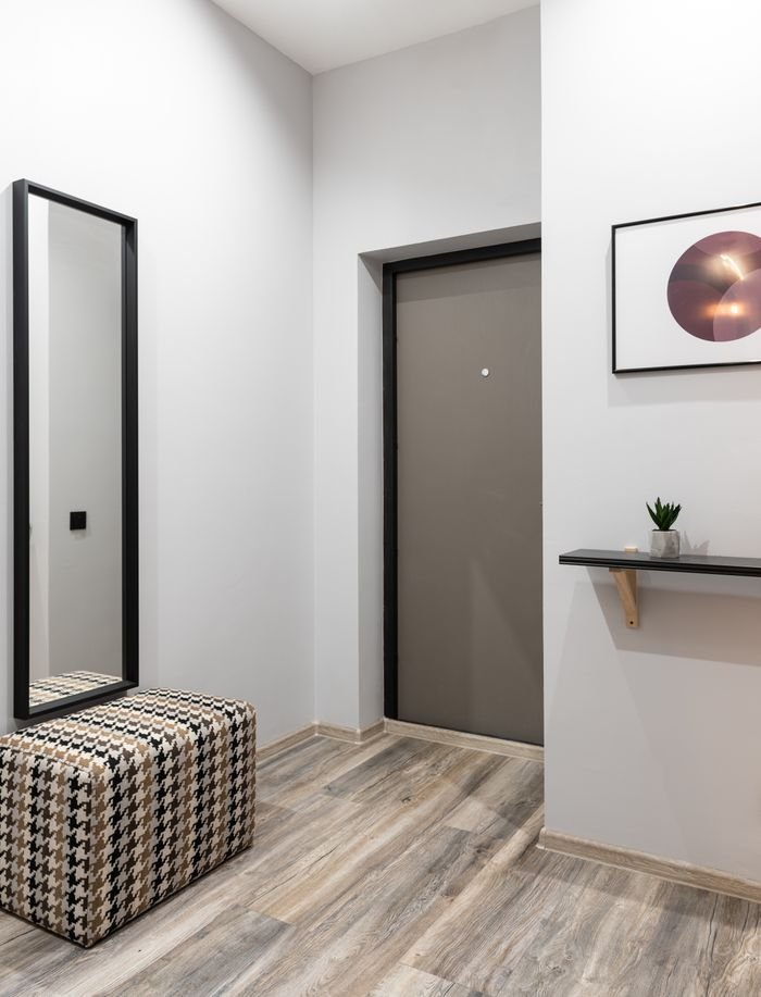 Interior of light hallway in minimalistic style placed in modern apartment in daytime